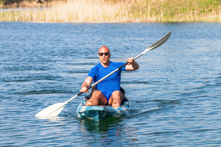 Young Man Kayaking on Lake. Lake Kayaking.の写真素材