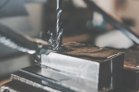 Metal drilling closeup. Metal workshop.の写真素材