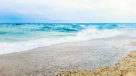 Tropical seascape waves crash over the beach. Sky and seaの写真素材