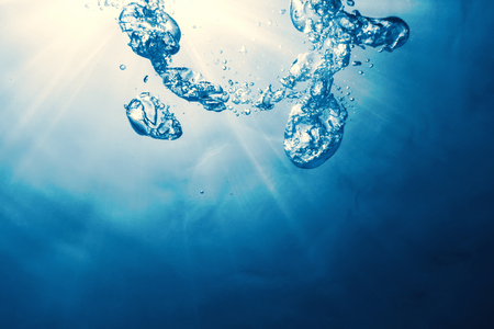 Underwater bubbles with sunlight. Underwater background bubbles.の写真素材