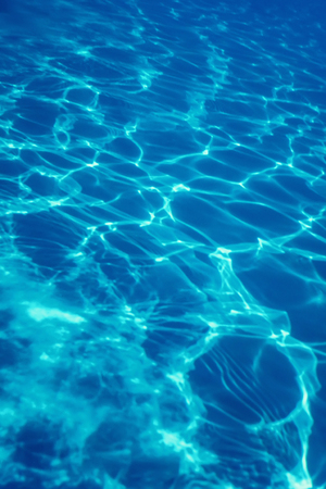 Swimming pool water sun reflection background. Ripple Water.の写真素材