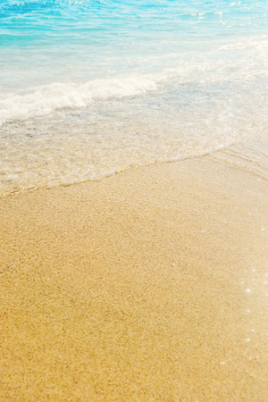 Wave of blue ocean on sandy beach Summer Backgroundの写真素材