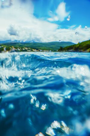 Sea Wave Close-up, Low Angle view Tropical Island on the surfaceの写真素材