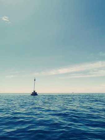 Small Lighthouse on the Horizon Blue Sky