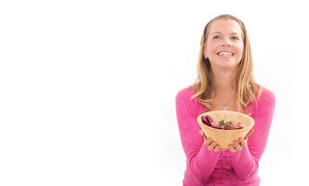 Female holding raw vegan healthy food. Raw food concept  bamboo bowlの写真素材