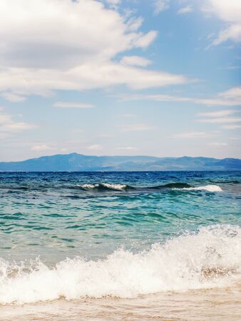 Wave of blue ocean on sandy beach Summer Backgroundの写真素材