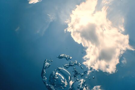 Underwater bubbles with sunlight. Underwater background bubbles.の写真素材