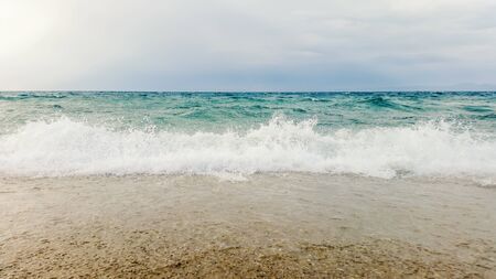 Tropical seascape waves crash over the beach. Sky and seaの写真素材