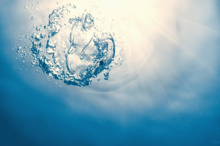 Underwater bubbles with sunlight. Underwater background bubbles.の写真素材