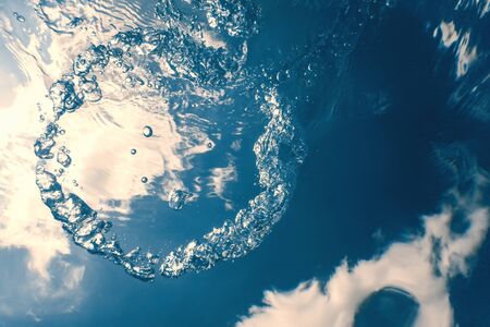 Underwater bubbles with sunlight. Underwater background bubbles.の写真素材