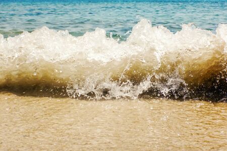 Wave of blue ocean on sandy beach Summer Backgroundの写真素材