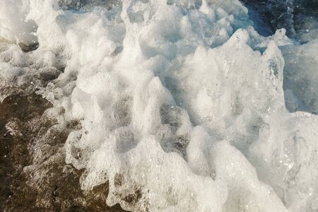 Wave of blue ocean on beach close up Summer Backgroundの写真素材