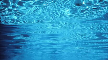 Water surface underwater, Swimming pool surface Water backgroundの写真素材