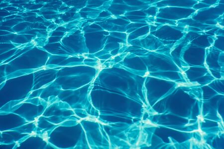 Swimming pool water sun reflection background. Ripple Water.の写真素材