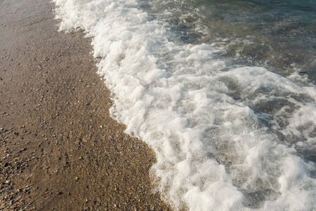 Wave of blue ocean on beach close up Summer Backgroundの写真素材