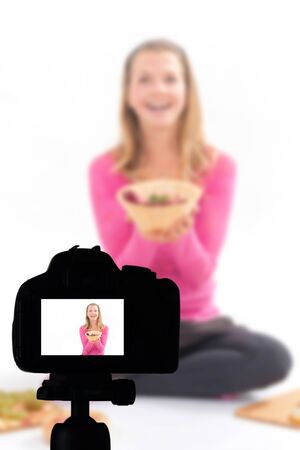 Young woman recording her video blog healthy food preparation, Food Blog conceptの写真素材