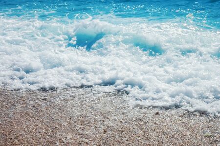 Breaking Wave of Blue Ocean on sandy beach Summer Backgroundの写真素材