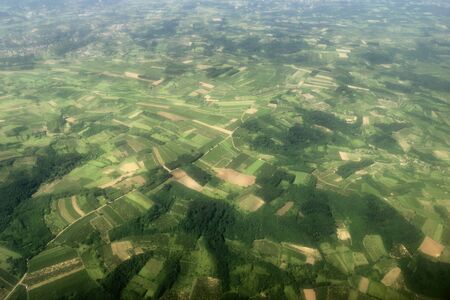 Aerial View of green fields, forest countrysideの写真素材