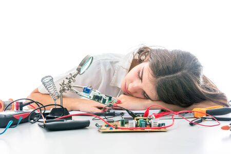 Woman Electronic TechnicianÂ Sleeping,Â Overworked and Tiredの写真素材