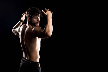 Bodybuilder Posing, Sporty Guy Male Power, Fitness Muscled Man, Spot Concept Copy Space, Dark Backgroundの写真素材