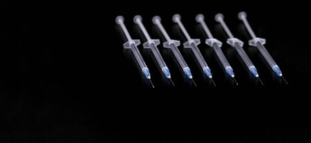 Medical Syringes NeedleÂ on Black Background, Close up Syringe, Health care conceptの写真素材