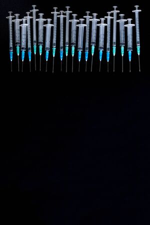 Medical Syringes with NeedleÂ on Black Background, Close up Syringe, Health care concept.の写真素材