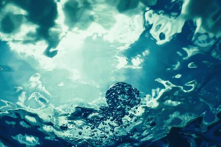 Underwater bubbles with sunlight. Underwater background bubbles.の写真素材