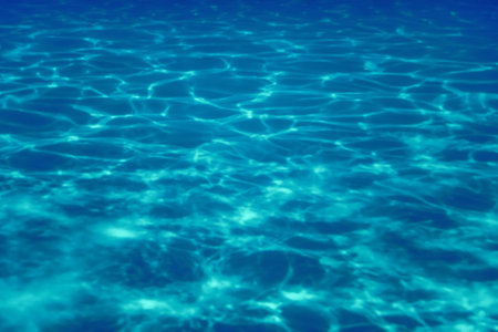 Swimming pool water sun reflection background. Ripple Water.