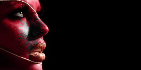 Albania flag painted on a face of a young woman, national flag on face
