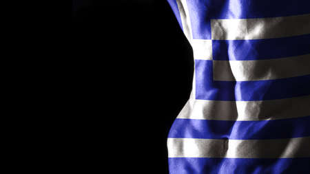 Greece flag on abs muscles national sport workout, bodybuilding concept, black backgroundの写真素材