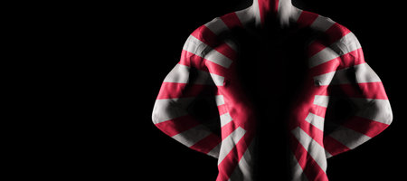 Rising Sun flag on muscled male torso with abs, black background