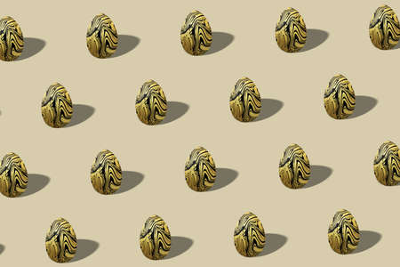 Golden Easter egg pattern made, gold trendy style egg, Minimal Easter conceptの写真素材