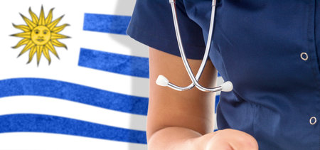 Uruguay flag female doctor with stethoscope, national healthcare systemの写真素材