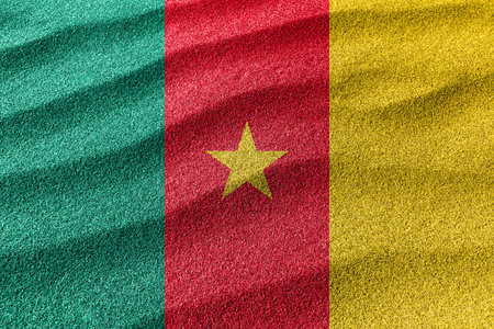 Cameroon sand flag, national flag sand backgroundの写真素材