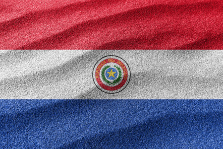 Paraguay sand flag, national flag sand background