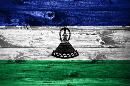 Lesotho flag on wooden planks background wood flagの写真素材