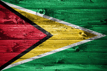 Guyana flag on wooden planks background wood flagの写真素材