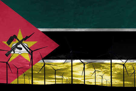 Mozambique flag wind farm at sunset, sustainable development, renewable energy Wind Turbinesの写真素材