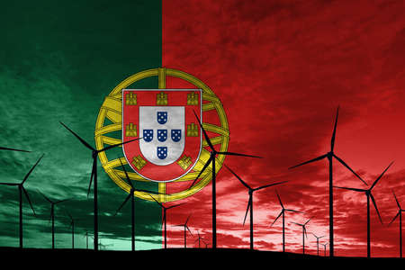 Portugal flag wind farm at sunset, sustainable development, renewable energy Wind Turbinesの写真素材