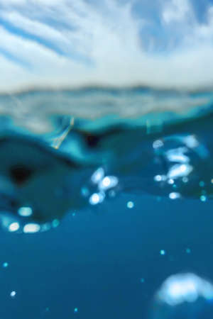 Underwater view of the blue sea surfaceの写真素材