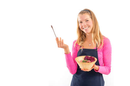 Young woman holding raw vegan healthy food. Raw food concept  bamboo bowlの写真素材