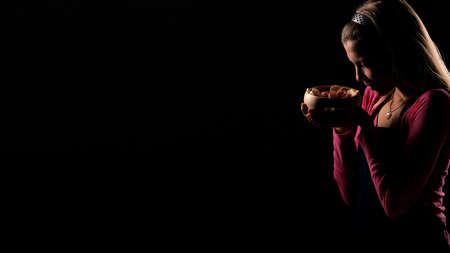 Female holding raw vegan healthy food. Raw food concept  bamboo bowlの写真素材