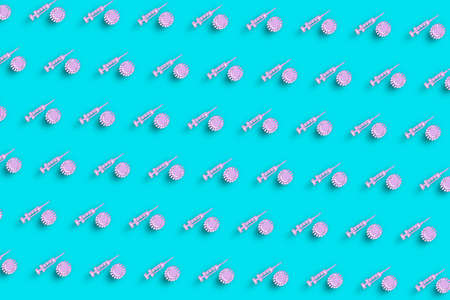 Stop Coronavirus concept, Medical Syringe symbol, Vaccination, Turquoise blue minimalist backgroundの写真素材