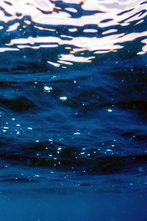 Underwater view of the blue sea surface