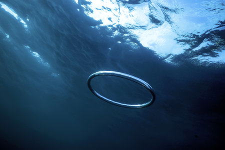 Bubble Ring Underwater Ascends Towards The Sunの写真素材