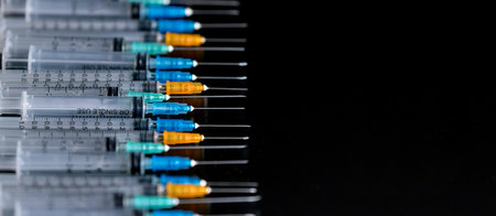 Medical Syringes with NeedleÂ on Black Background, Close up Syringe, Health care concept.の写真素材