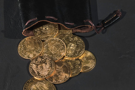 Austrian Gold Ducats in Leather Pouch on Black Background, Franz Josephの写真素材