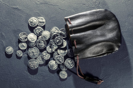 Leather pouch full of ancient silver coins treasure hoardの写真素材
