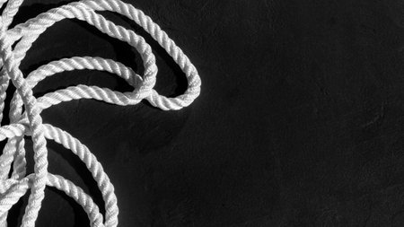 White Rope at Black Background Top View, With Copy Space