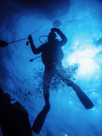 Scuba Diver at Safety Stop Underwater Bubbles, Sunlight